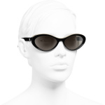oval sunglasses black beige acetate acetate packshot worn   axs  scaled