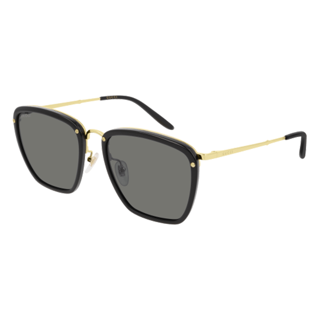 In un mix eclettico di materiali, questi occhiali da sole con montatura squadrata in acetato nero e struttura in metallo dorato che racchiude un paio di lenti grigie. Il logo Gucci decora le aste metalliche color oro.
